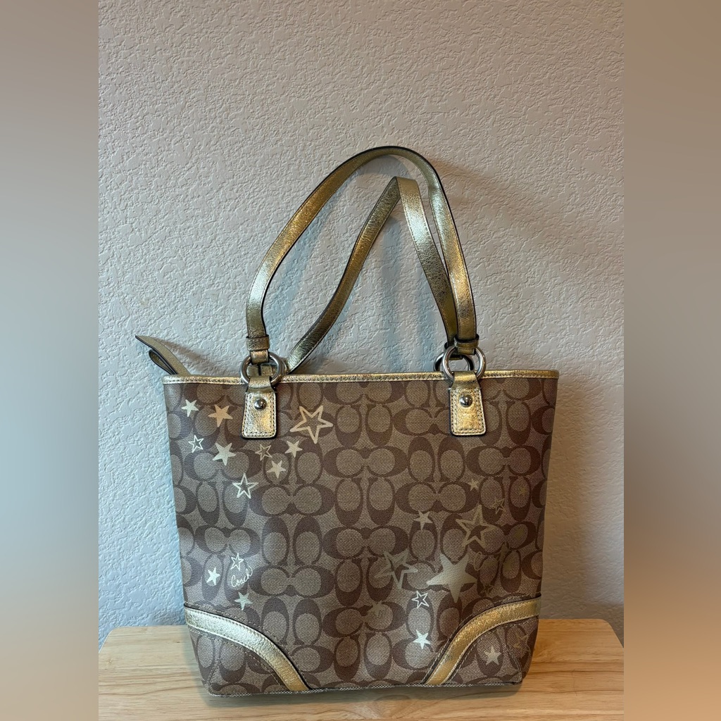 Coach Brown Signature Canvas Tote With Gold Accents And Star Print